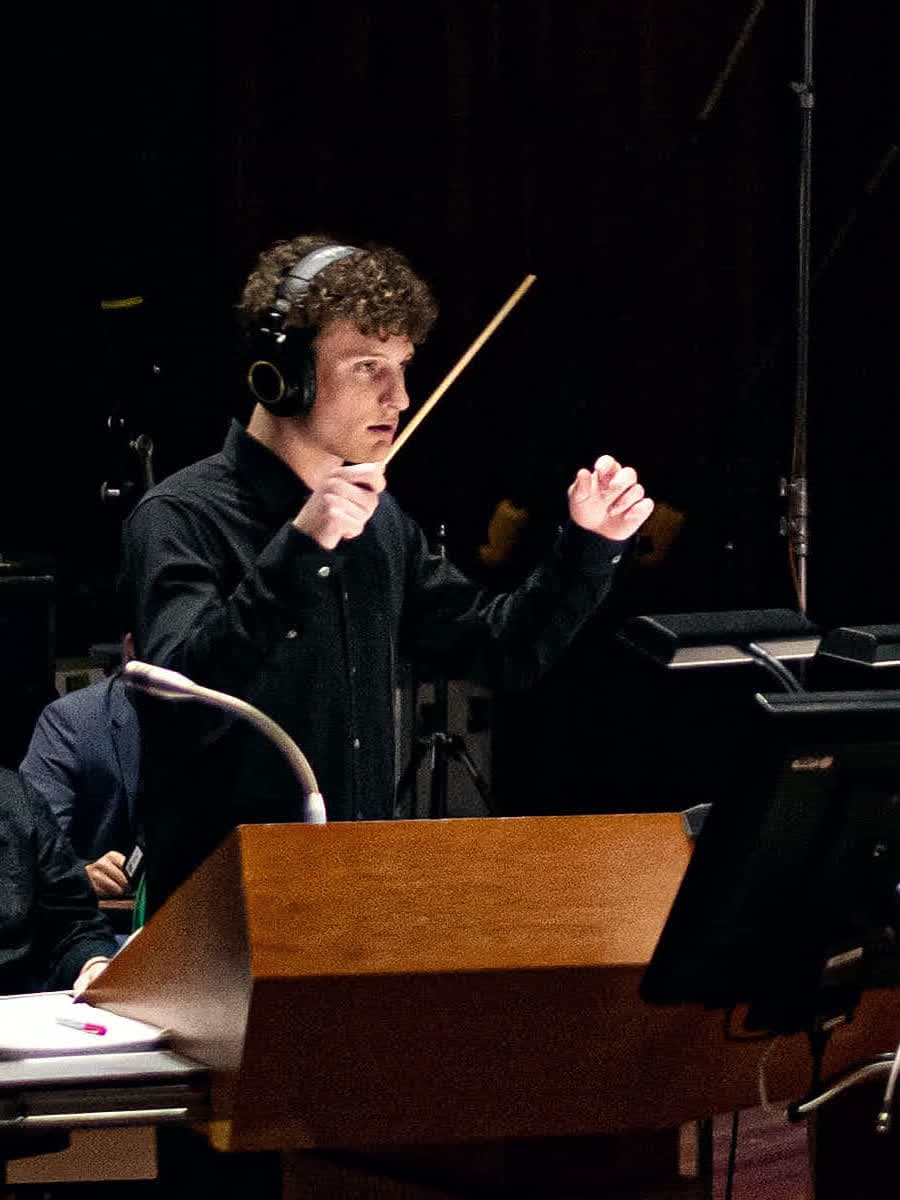 Portrait of Liam Diethrich conducting